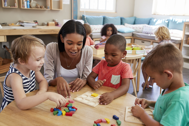 Preschoolers stacking and sorting blocks